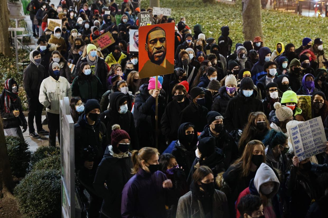 People gather in a Manhattan park to protest on the first day of the trial for the killing of George Floyd last May on March 8, 2021, in New York City. The jury selection was delayed on Monday in the trial of former Minneapolis police officer Derek Chauvin while an appeal proceeds over the possible reinstatement of a third-degree murder charge. Chauvin, who is being charged with second-degree murder and manslaughter in the death of Floyd, placed a knee on Floyd’s neck for nearly ten minutes resulting in the death of Floyd.