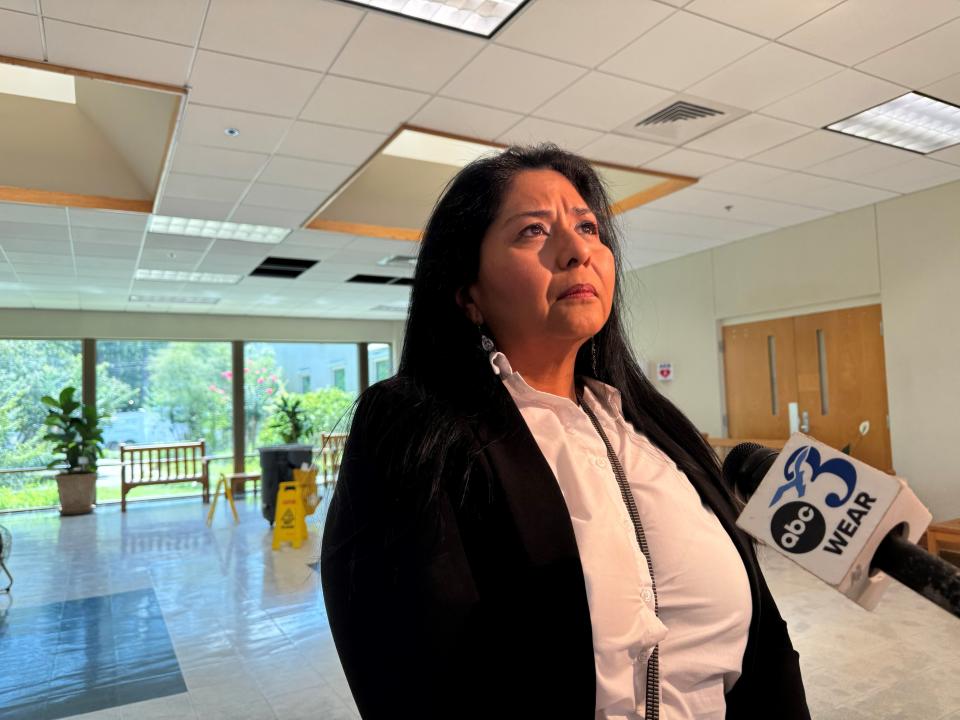 Grace Resendez McCaffery speaks to a television reporter following a June 24, 2024, Santa Rosa County commission meeting.