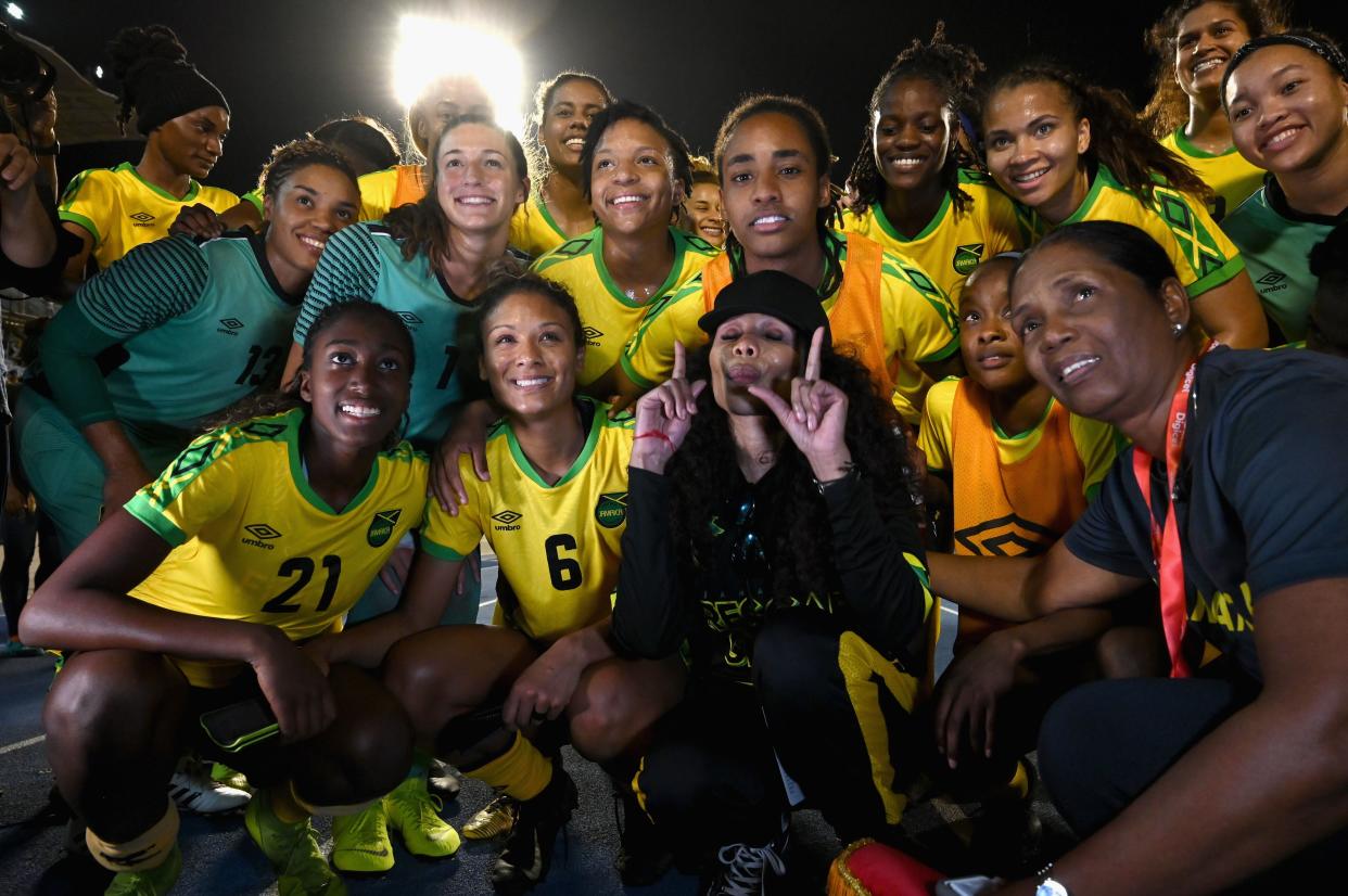 Cedella Marley (center) poses with members of the Jamaican women's national&nbsp; soccer team after a World Cup tune-up match in May. Thanks largely to Marley's financial support, Jamaica this summer became the first Caribbean nation to qualify for a Women's World Cup. (Photo: ANGELA WEISS via Getty Images)