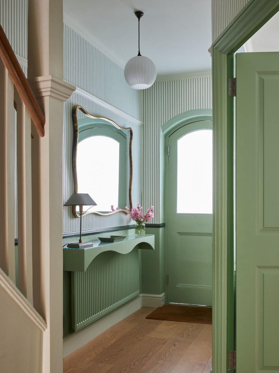 a hallway with a window and a sink