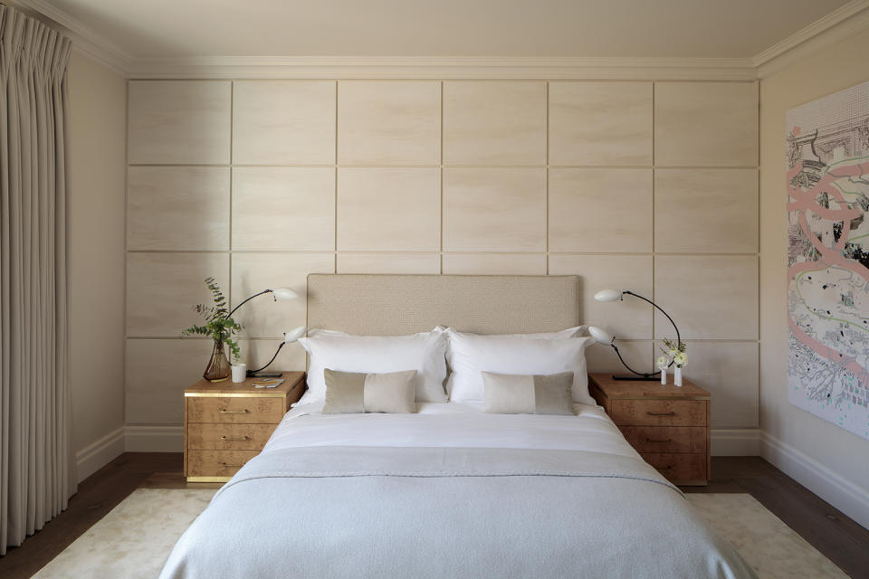 beige bedroom with wall panelling