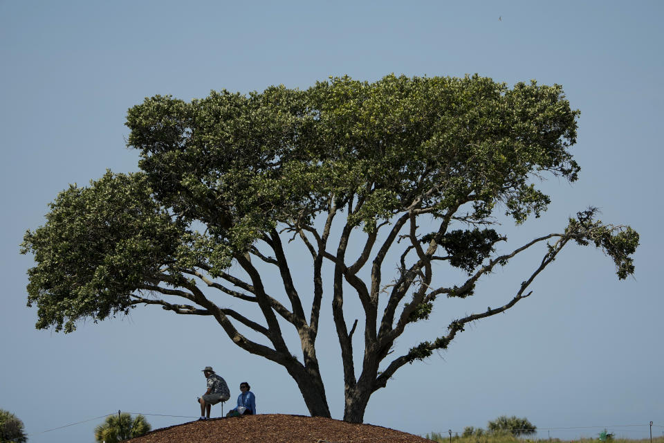Fans watch on the seventh hole during a practice round at the PGA Championship golf tournament on the Ocean Course Tuesday, May 18, 2021, in Kiawah Island, S.C. (AP Photo/David J. Phillip)
