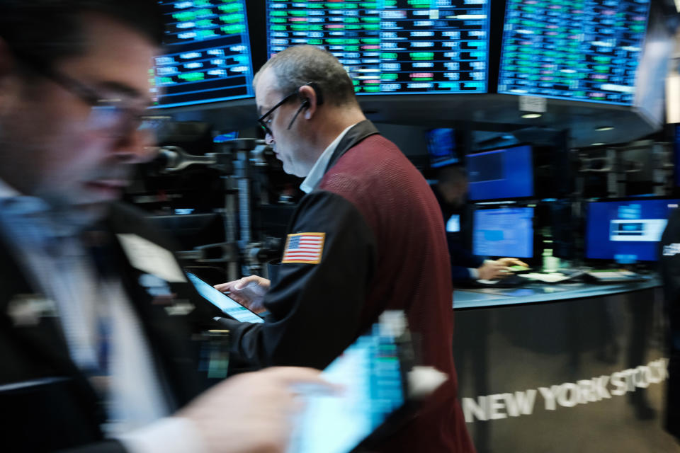 NEW YORK, NEW YORK - MARCH 16: Traders work on the floor of the New York Stock Exchange (NYSE) on March 16, 2022 in New York City. The Dow started off the day in positive territory, extending yesterday's rally. (Photo by Spencer Platt/Getty Images)