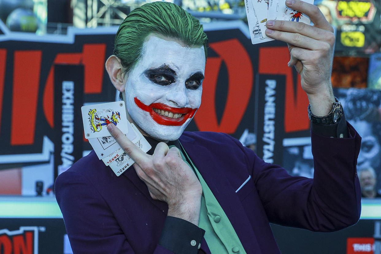 A cosplayer dressed as The Joker poses for photos as he attends the New York Comic Con 2019 at Jacob Javits Center on Oct. 5, 2019 in New York City. (Photo: Gordon Donovan/Yahoo News) 