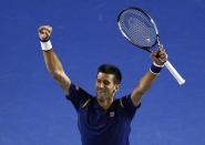 Serbia's Novak Djokovic celebrates after winning his semi-final match against Switzerland's Roger Federer at the Australian Open tennis tournament at Melbourne Park, Australia, January 28, 2016. REUTERS/Jason Reed