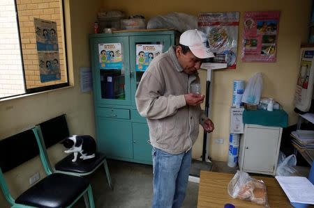 Francisco Verastegui, 56, receives his medicine for multidrug-resistant tuberculosis at El Progreso Health Centre in Carabayllo in Lima, Peru July 14, 2016. REUTERS/Mariana Bazo