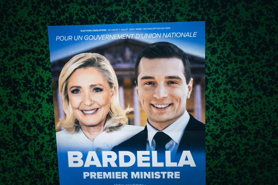 Rassemblement National (RN, extreme right) leaflet for the early legislative elections with a photo portrait of Marine Le Pen and Jordan Bardella smiling and the phrase Bardella prime minister in Paris, France on July 07, 2024. (Photo by Amaury Cornu / Hans Lucas / Hans Lucas via AFP) (Photo by AMAURY CORNU/Hans Lucas/AFP via Getty Images)