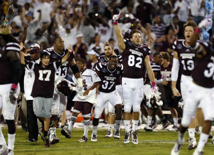 Mississippi State players celebrate the team&#39;s 38-23 win over No. 2 Auburn. (AP)