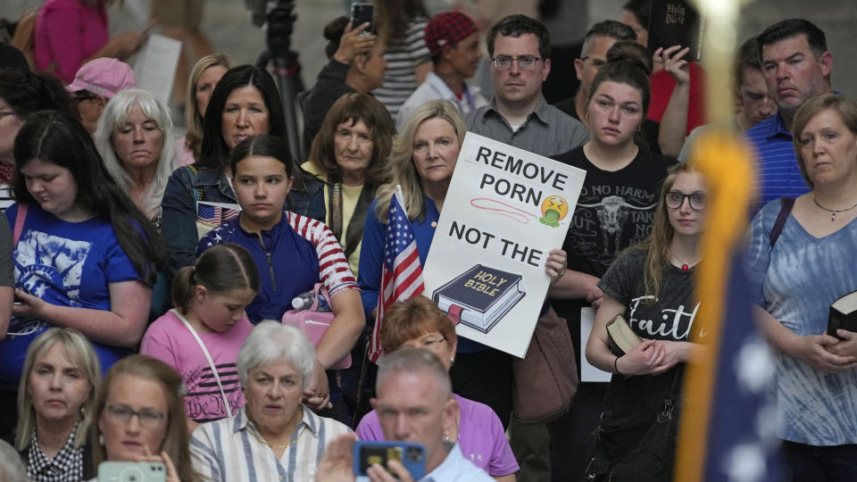 People gather during a rally Wednesday, June 7, 2023, at the Utah State Capitol, in Salt Lake City. Bible-toting parents and Republican lawmakers convened on Utah's Capitol to protest a suburban school district that announced it had removed the Bible from some schools last week. (AP Photo/Rick Bowmer)