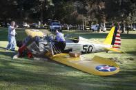 An airplane sits on the ground after crash landing at Penmar Golf Course in Venice, Los Angeles California March 5, 2015. Actor Harrison Ford was injured on Thursday in the crash of a small airplane outside Los Angeles, celebrity website TMZ reported. Reuters could not immediately confirm the report on TMZ, which said that Ford, 72, suffered multiple gashes to his head and was taken to a nearby hospital for treatment. (REUTERS/Lucy Nicholson)