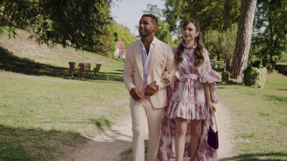 Emily in Paris. (L to R) Lucien Laviscount as Alfie, Lily Collins as Emily in episode 310 of Emily in Paris. Cr. Courtesy of Netflix © 2022