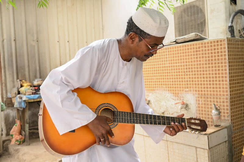 After Sudanese musician wife flees war, Sudanese music professor waits to travel to her in Port Sudan