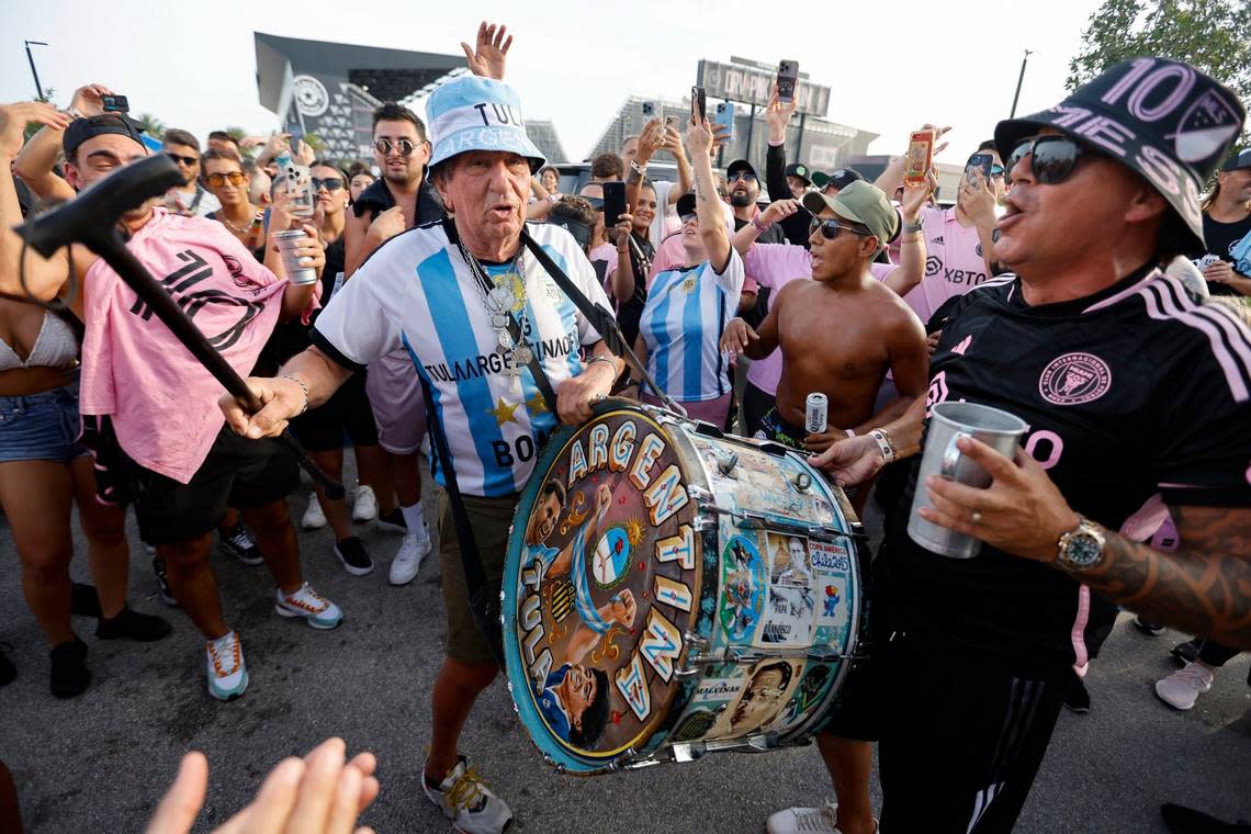 Soccer fans El Tula de Rosario and Cachito Cascardo, left to right, sing and beat the drums in a crowd during a tailgate party before the match between Inter Miami and Atlanta United in the Leagues Cup group stage match at DRV PNK Stadium in Fort Lauderdale, Fla. on Tuesday, July 25, 2023. 
