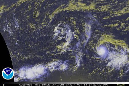 Tropical Storm Ana is seen in a NOAA satellite image taken at 19:30EDT (23:30GMT) October 14, 2014. REUTERS/NOAA/Handout