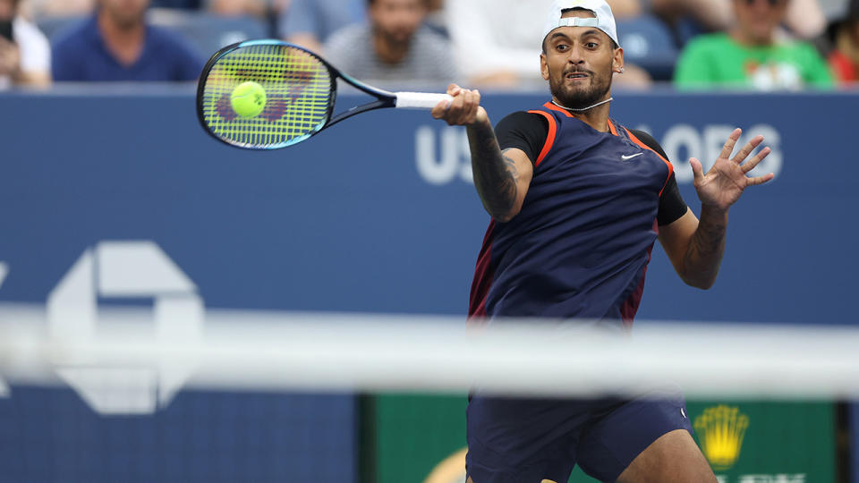 Nick Kyrgios hits a forehand shot at the 2022 US Open.