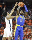 Pittsburgh guard Jamarius Burton (11) shoots next to Virginia guard Reece Beekman (2) during an NCAA college basketball game in Charlottesville, Va., Friday, Dec. 3, 2021. (AP Photo/Andrew Shurtleff)