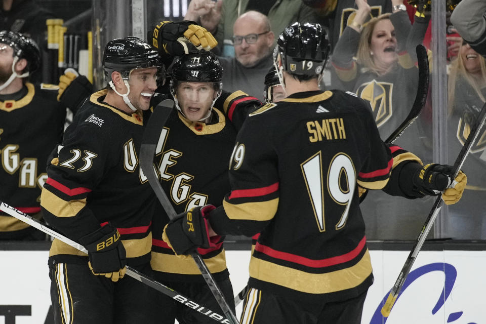 Vegas Golden Knights center William Karlsson, center, celebrates after scoring against the Edmonton Oilers during the second period of an NHL hockey game Saturday, Jan. 14, 2023, in Las Vegas. (AP Photo/John Locher)