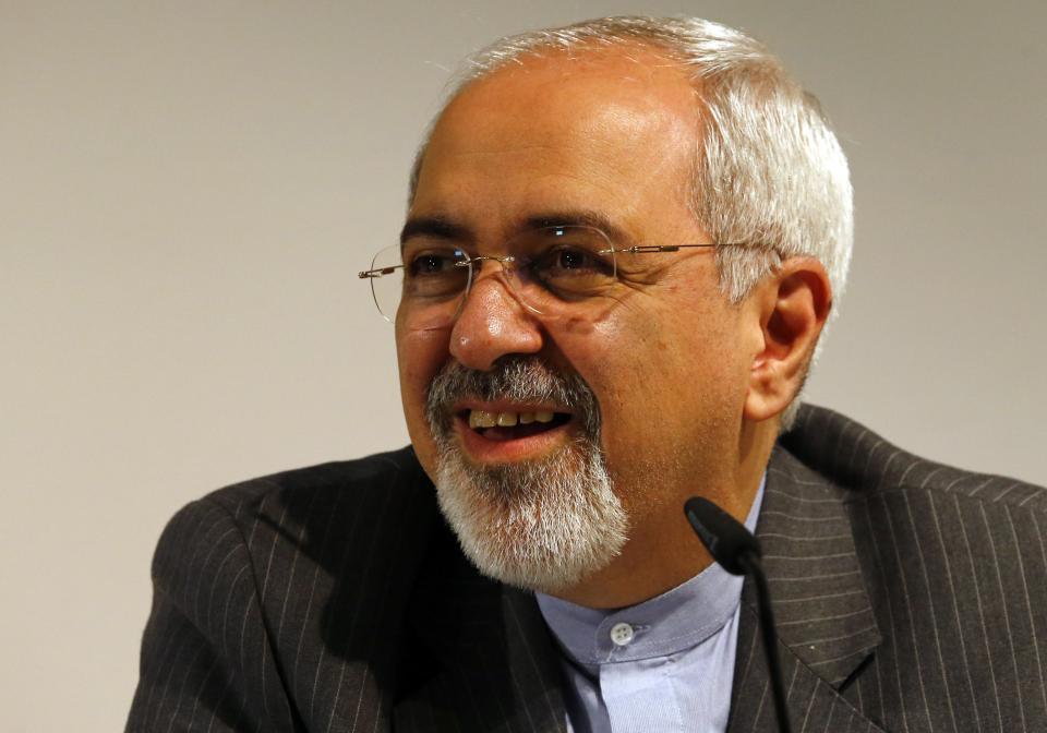 Iranian Foreign Minister Mohammad Javad Zarif smiles during a news conference after nuclear talks at the United Nations European headquarters in Geneva November 10, 2013. Ministers from Iran and the major powers held a series of meetings late on Saturday in a final push to hammer out the outline of a deal that would freeze parts of Iran's atomic programme in exchange for sanctions relief. REUTERS/Denis Balibouse (SWITZERLAND - Tags: POLITICS HEADSHOT)