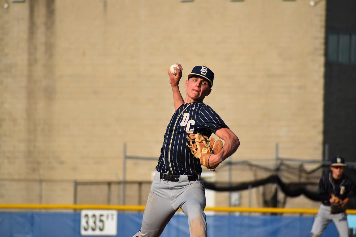 Decatur Central's Brayden Coffey prepares to throw a pitch during the Hawks' game with the Artesians on May 10, 2022.