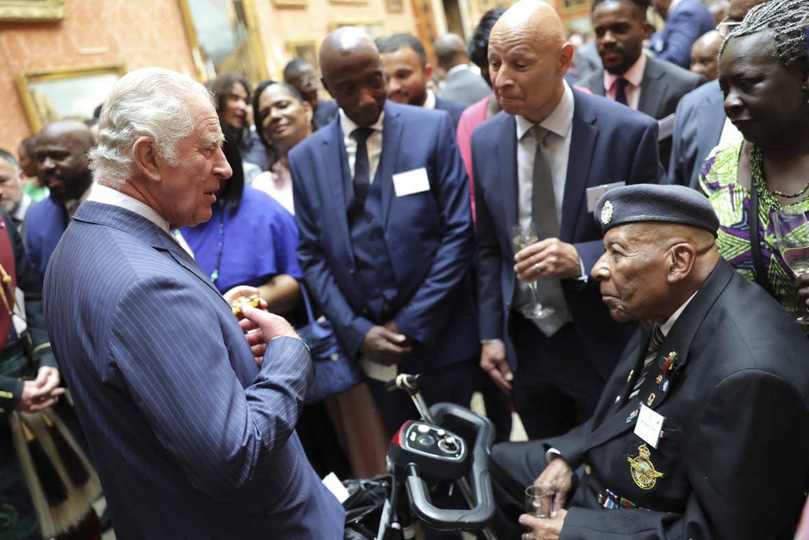 Britain’s King Charles III, left, speaks with a guest during a reception to mark the 75th anniversary of the arrival of HMT Empire Windrush, at Buckingham Palace in London, Wednesday June 14, 2023. (Chris Jackson, Pool via AP, FIle)