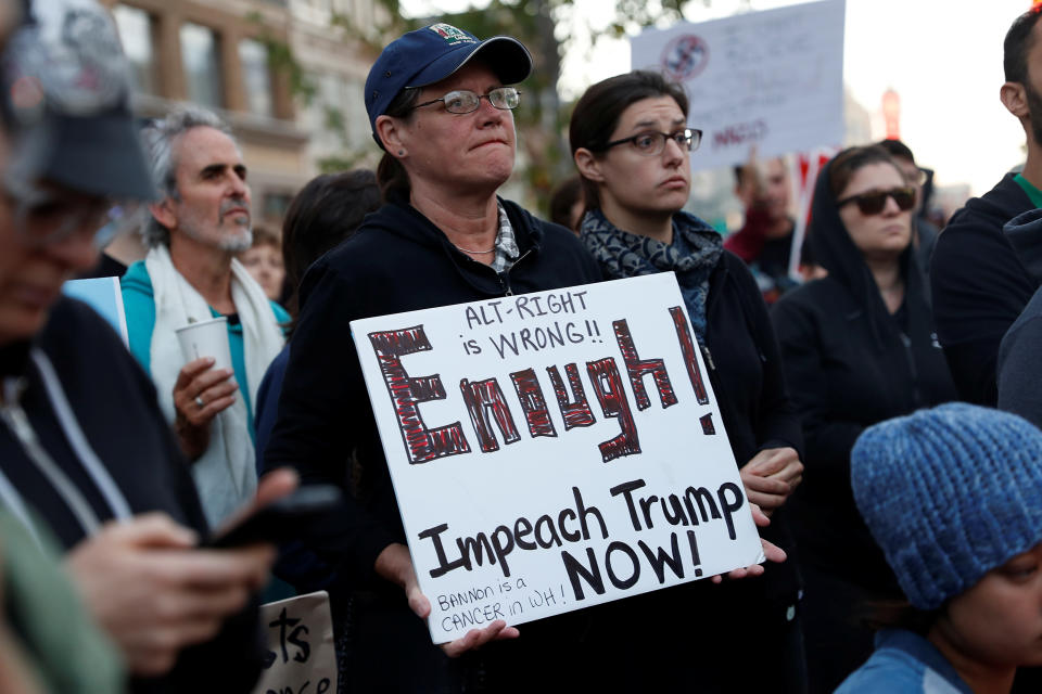 <p>A demonstrator holds sign during a rally in response to the Charlottesville, Virginia car attack on counter-protesters after the “Unite the Right” rally organised by white nationalists, in Oakland, California, U.S., August 12, 2017. (Stephen Lam/Reuters) </p>