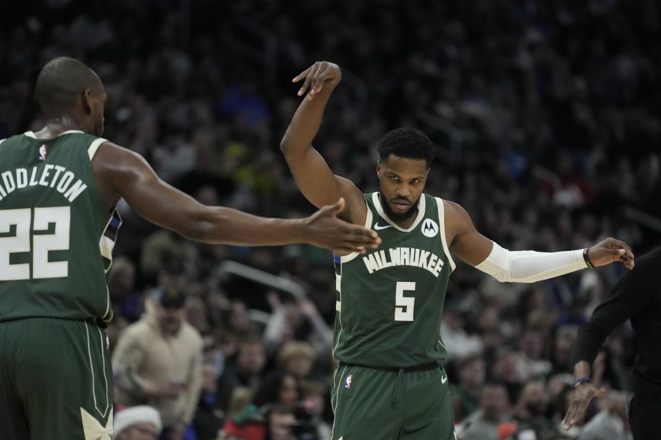 Milwaukee Bucks' Malik Beasley reacts after making a three pointer during the second half of an NBA basketball game against the Orlando Magic Thursday, Dec. 21, 2023, in Milwaukee. The Bucks won 118-114. (AP Photo/Morry Gash)