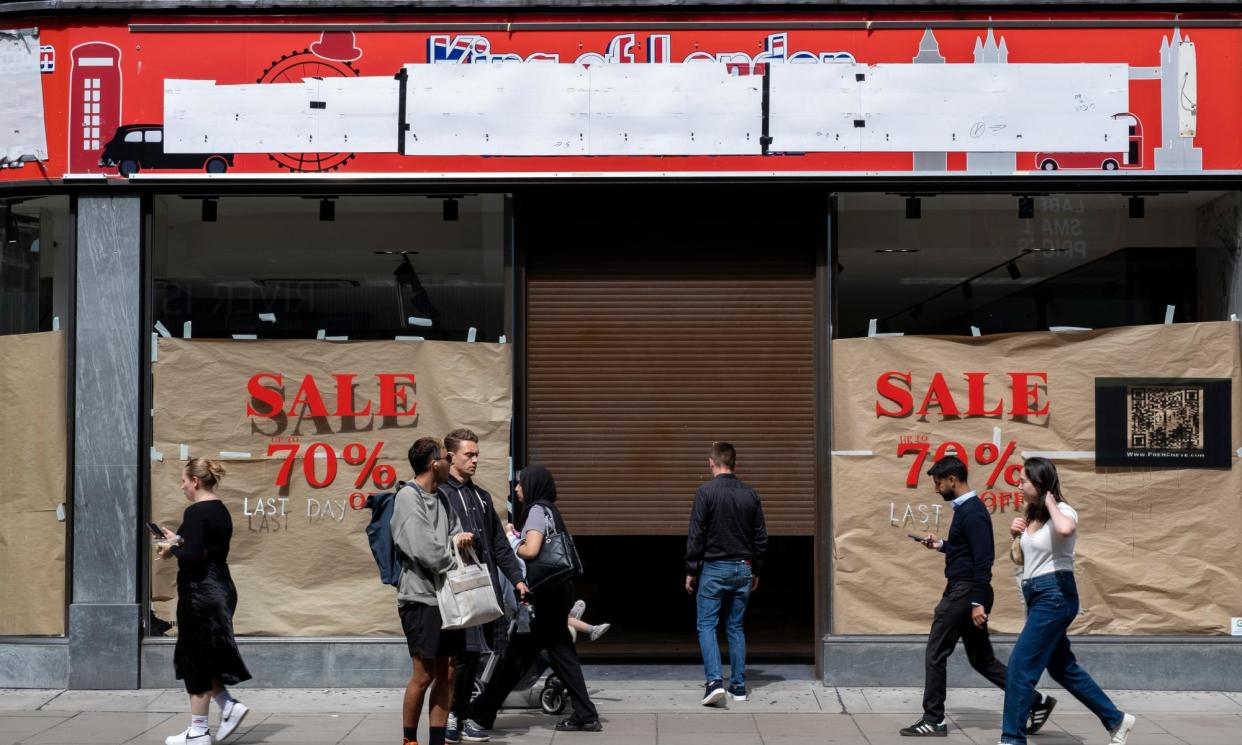 <span>Shoppers on Oxford Street pass by a closed down souvenir shop.</span><span>Photograph: Mike Kemp/In Pictures/Getty Images</span>