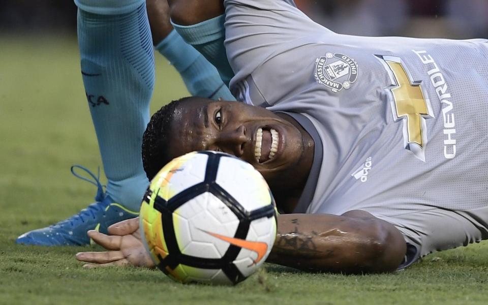 Antonio Valencia ends up on the ground as Neymar scores - Credit: AFP