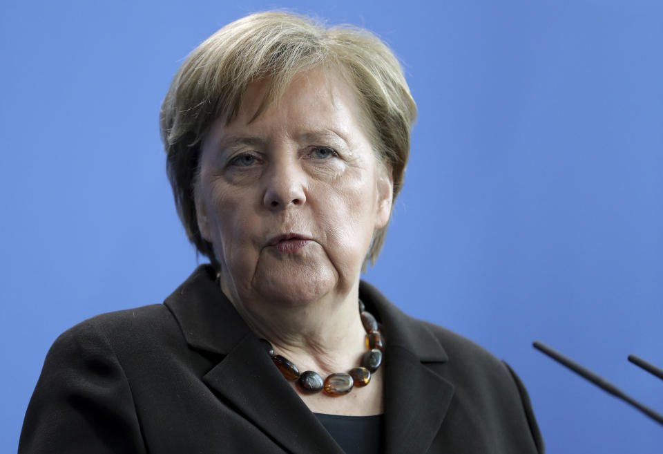 German Chancellor Angela Merkel addresses the media as part of a meeting with Sanna Marin, Prime Minister of Finland, at the chancellery in Berlin, Germany, Wednesday, Feb. 19, 2020. (AP Photo/Michael Sohn)