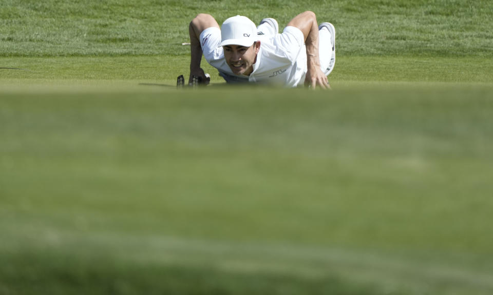 FILE - Camilo Villegas, of Colombia, studies his putt on the 14th green during the Mexico Open golf tournament's first round in Puerto Vallarta, Mexico, Thursday, April 27, 2023. Villegas turned to caddie Jose Campra as his coach in February. He won the Bermuda Championship last week and is headed back to the Masters. (AP Photo/Moises Castillo)