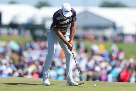 Jun 16, 2018; Southampton, NY, USA; Dustin Johnson putts the second green during the third round of the U.S. Open golf tournament at Shinnecock Hills GC - Shinnecock Hills Golf C. Mandatory Credit: Brad Penner-USA TODAY Sports