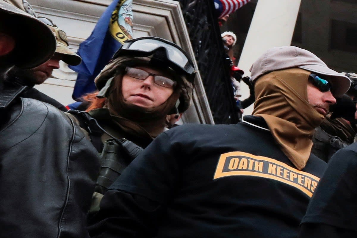 Jessica Watkins, left, appears with members of the Oath Keepers on 6 January, 2021 at the US Capitol. (REUTERS)