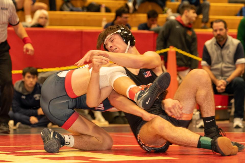 Somerville’s Lucas Marchese (green) beats Pingry’s Charles Levine (red) in the 144 weight class at the 2023 Somerset County Boys Wrestling Tournament on Jan. 7 at the gymnasium at Hillsborough High School in Hillsborough.