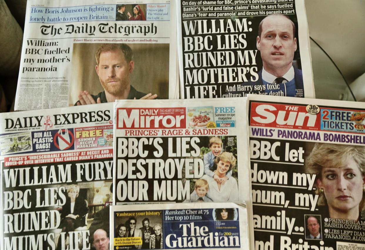 An arrangement of UK daily newspapers shows front page headlines reporting Prince William and his brother Prince Harry's accusations towards BBC in London, United Kingdom on May 21, 2021. (Getty Images)