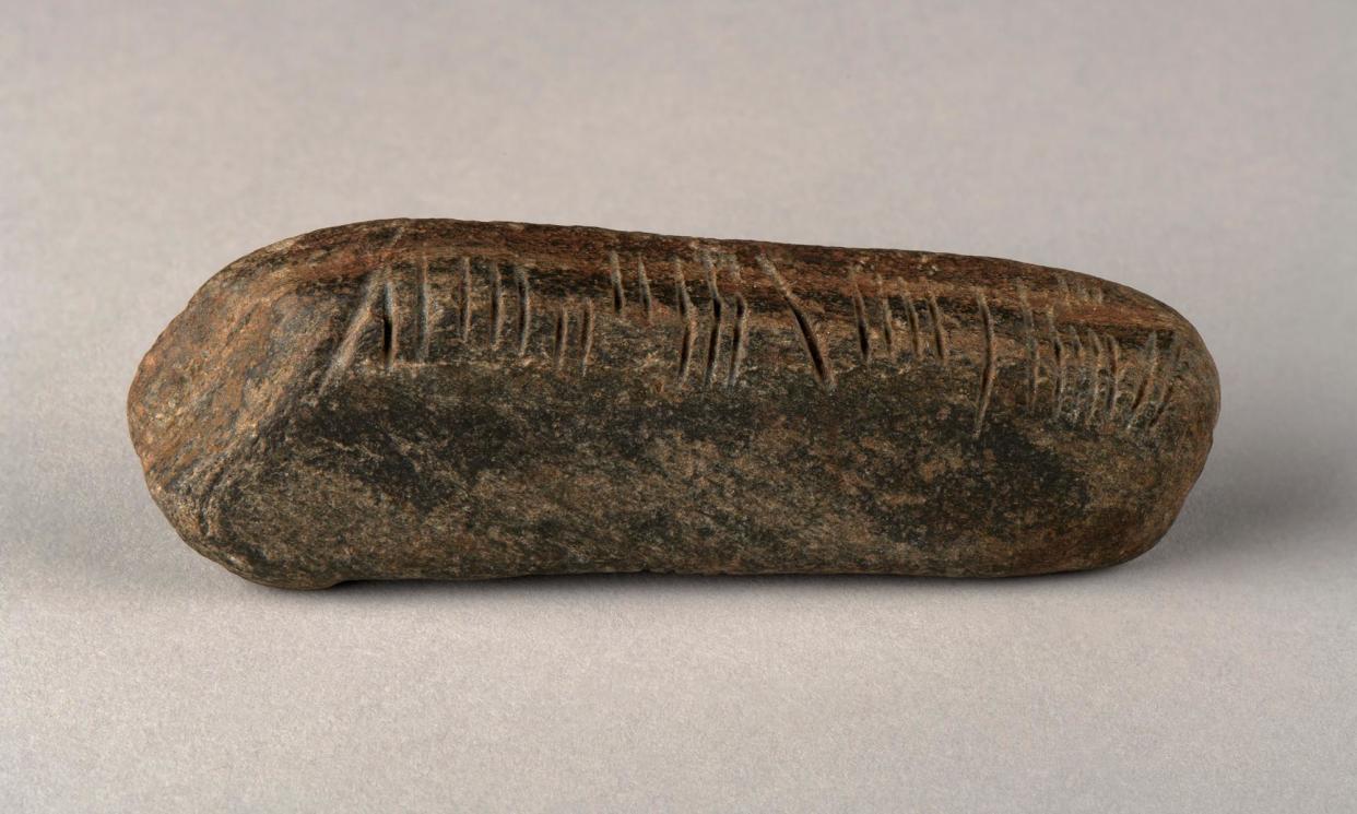 <span>The ogham stone, 11cm long and weighing 139g, was found in an overgrown garden.</span><span>Photograph: The Herbert Art Gallery and Museum</span>