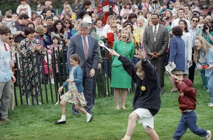 President Bill Clinton handles the starting whistling and first lady Hillary Rodham Clinton handles cheer leading chores during the annual Easter egg roll on the White House lawn in Washington, April 12, 1993. (AP Photo/Ron Edmonds) ORG XMIT: APHS341978 [Via MerlinFTP Drop]