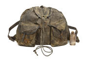 One of the backpacks together with a glass bottle from one of its pockets from Captain Scott's 1912 expedition. ©Canterbury Museum, New Zealand.