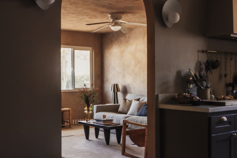 View from kitchen into living room through arch