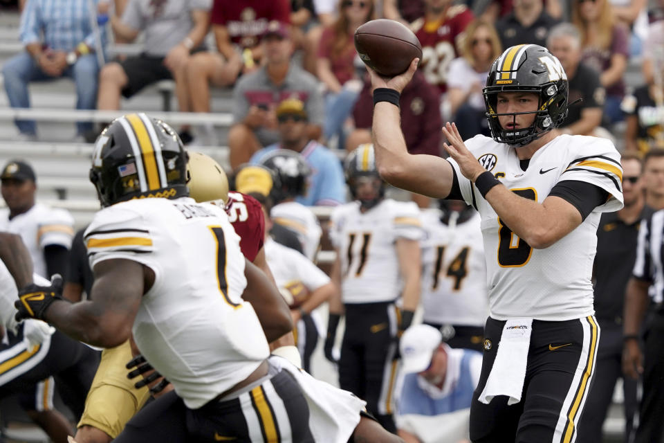 Missouri quarterback Connor Bazelak (8) passes to Tyler Badie (1) during the first half of an NCAA college football game against Boston College, Saturday, Sept. 25, 2021, in Boston. (AP Photo/Mary Schwalm)