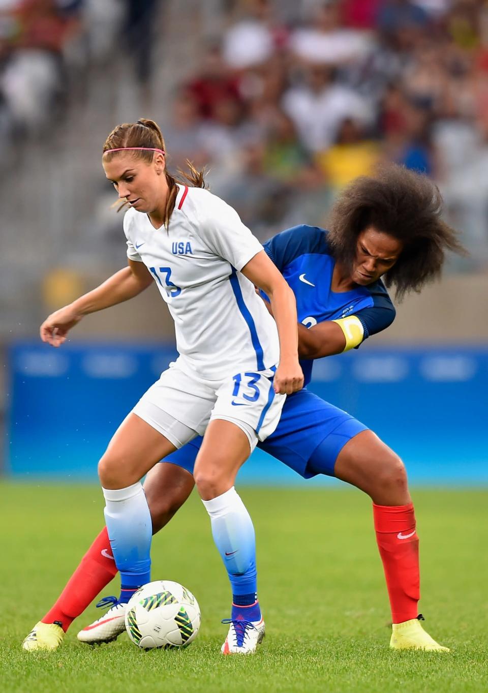 <p>Alex Morgan of United States battles for the ball against Wendie Renard of FraFrance during the Women’s Group F first round match between United States and France during Day 1 of the Rio 2016 Olympic Games at Mineirao Stadium on August 6, 2016 in Belo Horizonte, Brazil. (Photo by Pedro Vilela/Getty Images) </p>