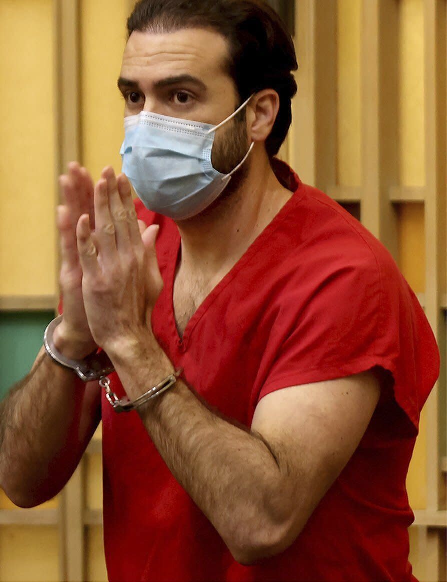 Mexican actor Pablo Lyle gestures toward family members as he leaves the courtroom after Judge Maria Tinkler Mendez ruled against a new trial for Lyle as he, his family, lawyers, and members of the media gathered in Courtroom 4-6 at the Richard E. Gerstein Justice Building in Miami, Fla. on Monday, Dec. 12, 2022. (Carl Juste/Miami Herald via AP)