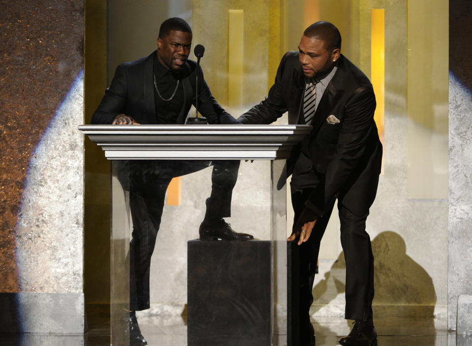 Kevin Hart, left, and Anthony Anderson speak on stage at the 45th NAACP Image Awards at the Pasadena Civic Auditorium on Saturday, Feb. 22, 2014, in Pasadena, Calif. (Photo by Chris Pizzello/Invision/AP)