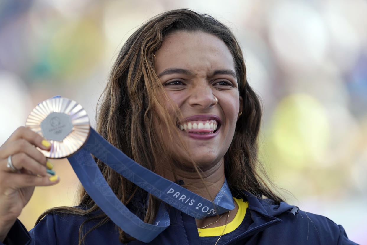 Rayssa Leal, of Brazil, poses with her bronze medal after the women's skateboard street final at the 2024 Summer Olympics, Sunday, July 28, 2024, in Paris, France. (AP Photo/Vadim Ghirda)