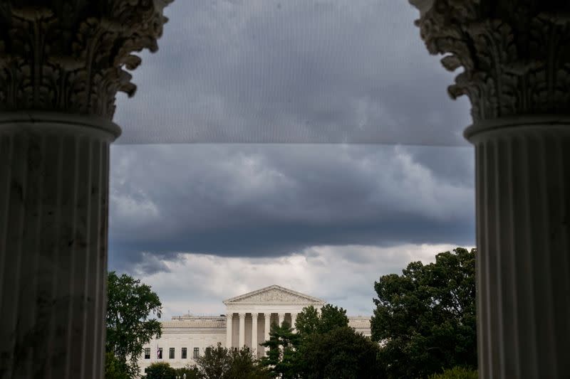 FILE PHOTO: The U.S. Supreme Court is seen through the U.S. Capitol columns in Washington