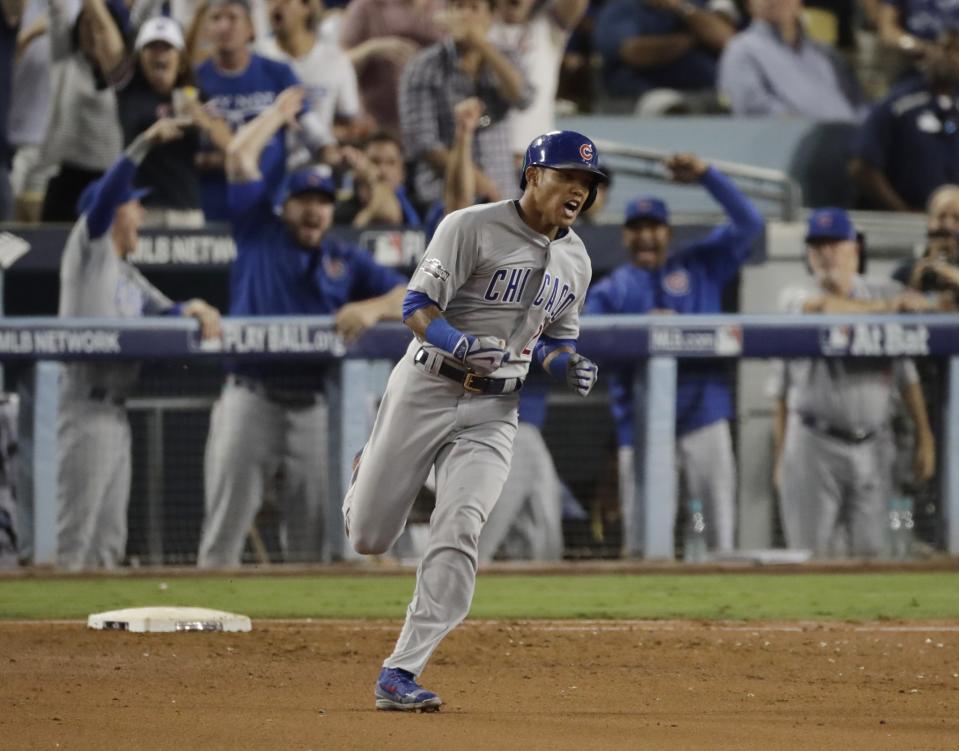 Addison Russell celebrates his fourth-inning homer. (AP)