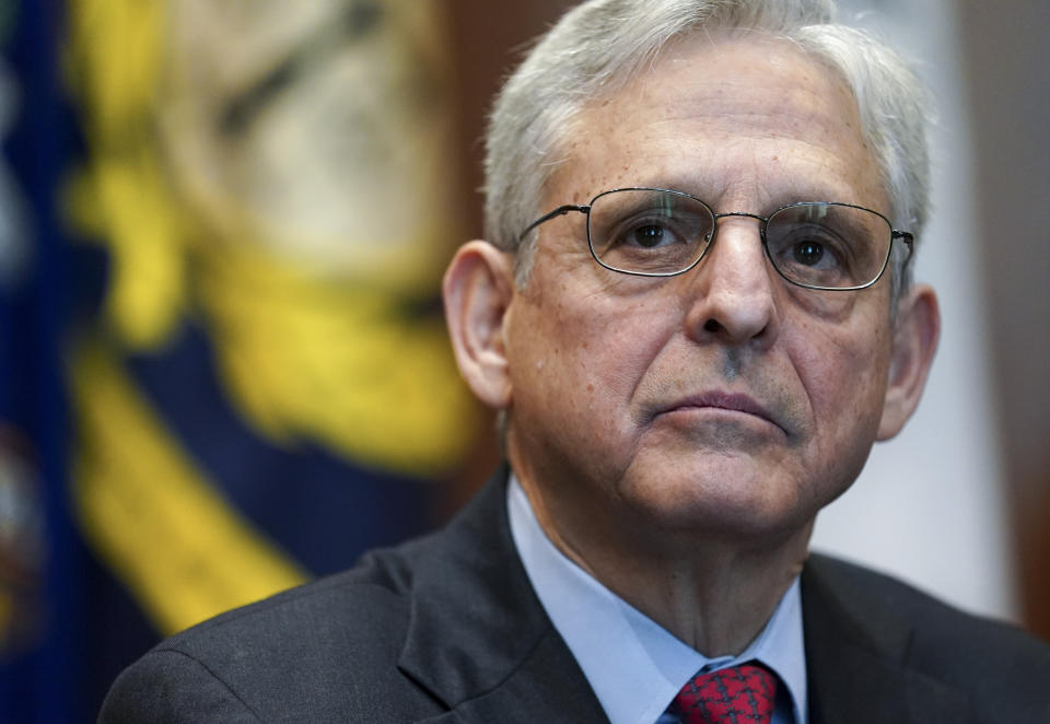 FILE - Attorney General Merrick Garland listens during a meeting of the COVID-19 Fraud Enforcement Task Force at the Justice Department, March 10, 2022 in Washington. The lawmakers investigating the Jan. 6 attack on the Capitol have been increasingly using their public statements, court filings and committee reports to deliver a blunt message to Garland and the Department of Justice to act on their findings. (Kevin Lamarque/Pool Photo via AP, File)