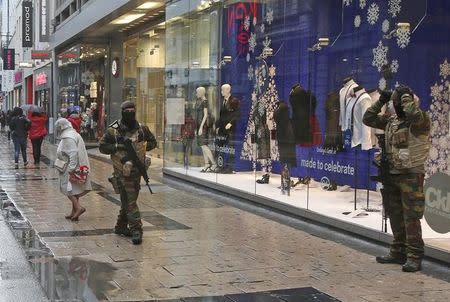 Belgian soldiers patrol a shopping street in central Brussels, November 21, 2015. REUTERS/Youssef Boudlal