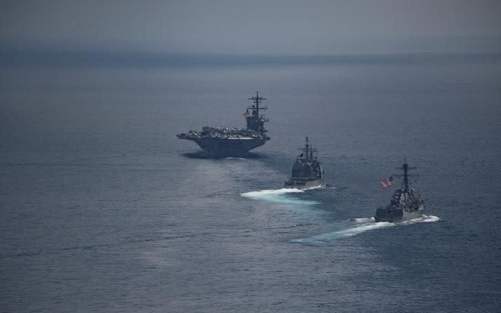 The aircraft carrier USS Carl Vinson (CVN 70), front, leads the Arleigh Burke-class guided-missile destroyer USS Michael Murphy (DDG 112) and the Ticonderoga-class guided-missile cruiser USS Lake Champlain - Credit: US NAVY