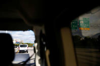 U.S. President Donald Trump's motorcade is seen en route to Trump National Golf Club Jupiter in Jupiter, Florida, U.S., November 24, 2017. REUTERS/Eric Thayer