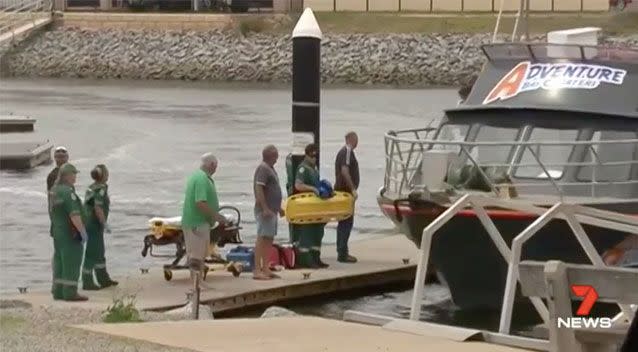 Paramedics awaited the boat's return.